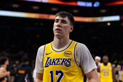 Phoenix, Arizona, USA; Los Angeles Lakers forward Jake LaRavia (12) against the Phoenix Suns at Mortgage Matchup Center. Mandatory Credit: Mark J. Rebilas-Imagn Images
