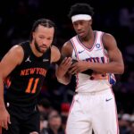 New York, New York, USA; New York Knicks guard Jalen Brunson (11) defends Philadelphia 76ers guard VJ Edgecombe (77) during the third quarter at Madison Square Garden. Mandatory Credit: Brad Penner-Imagn Images