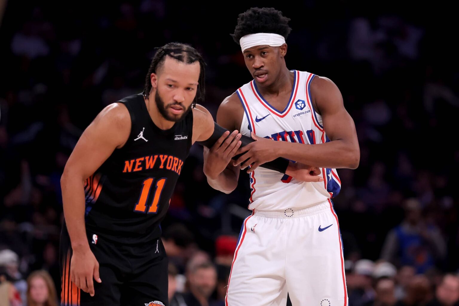 New York, New York, USA; New York Knicks guard Jalen Brunson (11) defends Philadelphia 76ers guard VJ Edgecombe (77) during the third quarter at Madison Square Garden. Mandatory Credit: Brad Penner-Imagn Images