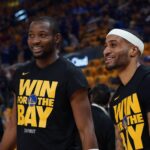 San Francisco, California, USA; Golden State Warriors forward Jonathan Kuminga (00) and guard Gary Payton II (0) warm up before Game 3 of the second round of the 2025 NBA Playoffs against the Minnesota Timberwolves at Chase Center. Mandatory Credit: David Gonzales-Imagn Images