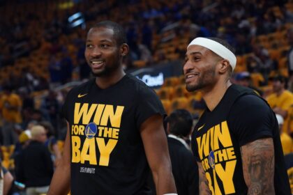 San Francisco, California, USA; Golden State Warriors forward Jonathan Kuminga (00) and guard Gary Payton II (0) warm up before Game 3 of the second round of the 2025 NBA Playoffs against the Minnesota Timberwolves at Chase Center. Mandatory Credit: David Gonzales-Imagn Images