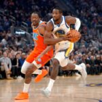 San Francisco, California, USA; Golden State Warriors forward Jonathan Kuminga (1) drives past Oklahoma City Thunder guard Jalen Williams (8) in the first quarter at the Chase Center. Mandatory Credit: Cary Edmondson-Imagn Images