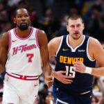 Denver, Colorado, USA; Houston Rockets forward Kevin Durant (7) and Denver Nuggets center Nikola Jokic (15) during the second quarter at Ball Arena. Mandatory Credit: Ron Chenoy-Imagn Images