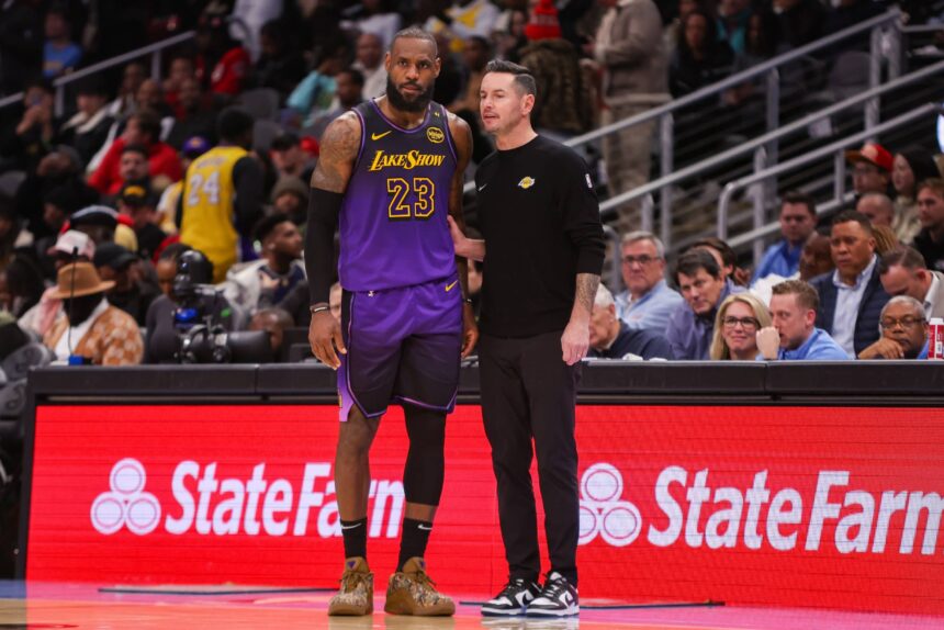Atlanta, Georgia, USA; Los Angeles Lakers forward LeBron James (23) talks to head coach JJ Redick against the Atlanta Hawks in the second quarter at State Farm Arena. Mandatory Credit: Brett Davis-Imagn Images
