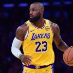 Los Angeles, California, USA; Los Angeles Lakers forward LeBron James (23) brings the ball up court against the Phoenix Suns during the second half at Crypto.com Arena. Mandatory Credit: Gary A. Vasquez-Imagn Images