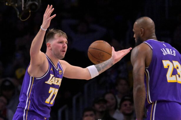 Los Angeles, California, USA; Los Angeles Lakers guard Luka Doncic (77) and forward Lebron James (23) react after a foul call during the second half against the San Antonio Spurs at Crypto.com Arena. Mandatory Credit: Jayne Kamin-Oncea-Imagn Images