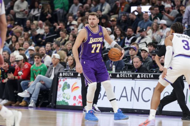 Salt Lake City, Utah, USA; Los Angeles Lakers forward/guard Luka Doncic (77) dribbles during the first quarter against the Utah Jazz at Delta Center. Mandatory Credit: Chris Nicoll-Imagn Images