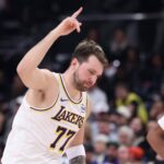 Salt Lake City, Utah, USA; Los Angeles Lakers guard Luka Doncic (77) reacts to a shot against the Utah Jazz during the second half at Delta Center. Mandatory Credit: Rob Gray-Imagn Images