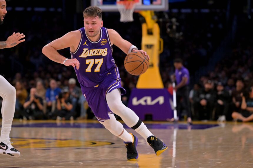 Los Angeles, California, USA; Los Angeles Lakers guard Luka Doncic (77) handles the ball during the second half against the San Antonio Spurs at Crypto.com Arena. Mandatory Credit: Jayne Kamin-Oncea-Imagn Images