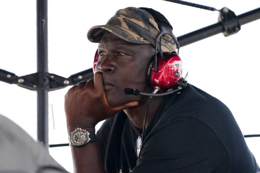 Homestead, Florida, USA; 23XI Team co-owner Michael Jordan sits atop of the pitbox during the 4EVER 400 presented by Mobil 1 at Homestead-Miami Speedway. Mandatory Credit: Jasen Vinlove-Imagn Images
