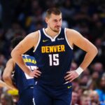 Denver, Colorado, USA; Denver Nuggets center Nikola Jokic (15) reacts in the second quarter against the Houston Rockets at Ball Arena. Mandatory Credit: Ron Chenoy-Imagn Images