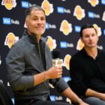 El Segundo, CA, USA; Los Angeles Lakers general manager Rob Pelinka, left, speaks during a press conference to preview the 2025-26 season at UCLA Health Training Center. Mandatory Credit: William Liang-Imagn Images