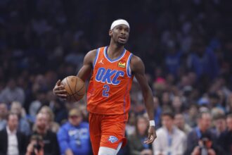 Oklahoma City, Oklahoma, USA; Oklahoma City Thunder guard Shai Gilgeous-Alexander (2) dribbles down the court against the Minnesota Timberwolves during the first quarter at Paycom Center. Mandatory Credit: Alonzo Adams-Imagn Images