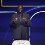 Washington, District of Columbia, USA; Shaquille O'Neal draws the card of Iran for Group G during the FIFA World Cup 2026 Final Draw at John F. Kennedy Center for the Performing Arts. Mandatory Credit: Amber Searls-Imagn Images