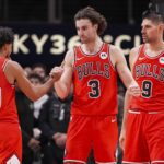 Atlanta, Georgia, USA; Chicago Bulls guard Tre Jones (30) guard Josh Giddey (3) and center Nikola Vucevic (9) react after defeating the Atlanta Hawks at State Farm Arena. Mandatory Credit: Dale Zanine-Imagn Images