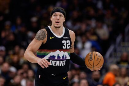Jan 17, 2026; Denver, Colorado, USA; Denver Nuggets forward Aaron Gordon (32) dribbles the ball up court in the first quarter against the Washington Wizards at Ball Arena. Mandatory Credit: Isaiah J. Downing-Imagn Images