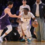 Sacramento Kings forward Doug McDermott (7) guards Los Angeles Lakers forward Adou Thiero (1) in the second half at Crypto.com Arena.