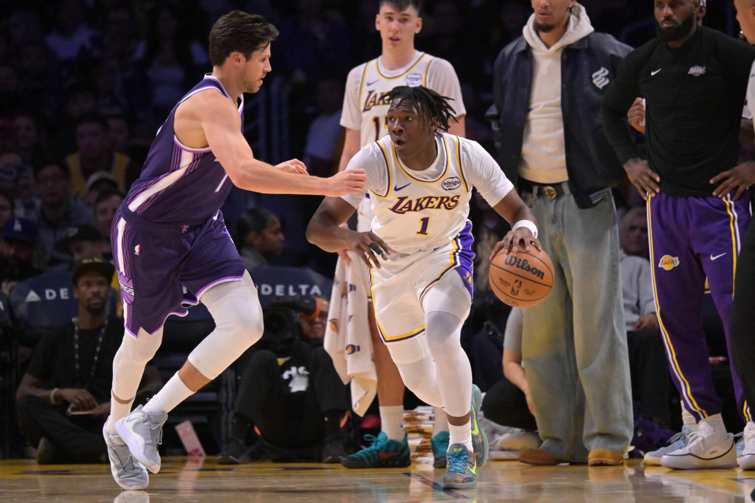 Sacramento Kings forward Doug McDermott (7) guards Los Angeles Lakers forward Adou Thiero (1) in the second half at Crypto.com Arena.
