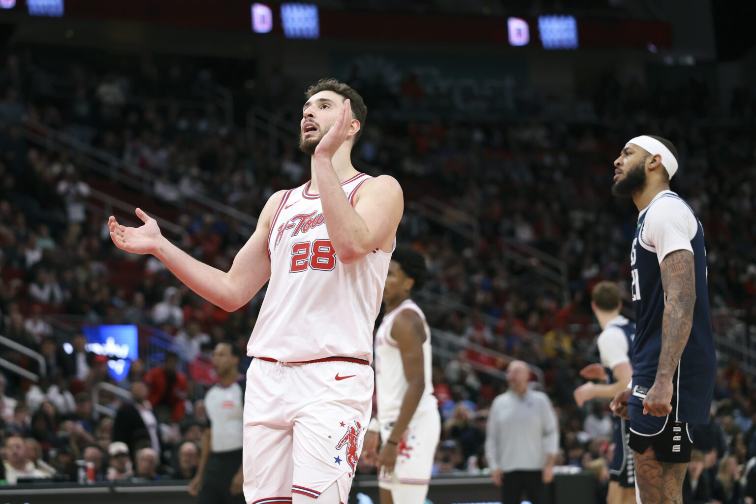 Jan 31, 2026; Houston, Texas, USA; Houston Rockets center Alperen Sengun (28) reacts after a play during the fourth quarter against the Dallas Mavericks at Toyota Center. Mandatory Credit: Troy Taormina-Imagn Images