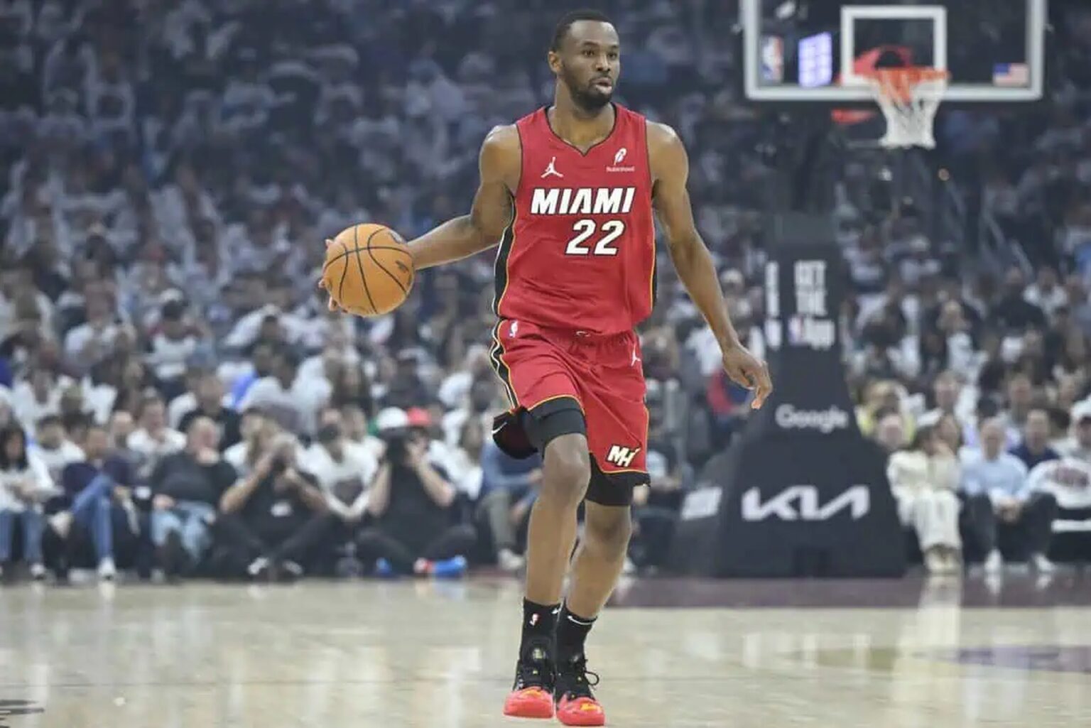 Apr 20, 2025; Cleveland, Ohio, USA; Miami Heat forward Andrew Wiggins (22) brings the ball up court in the first quarter against the Cleveland Cavaliers at Rocket Arena. Mandatory Credit: David Richard-Imagn Images