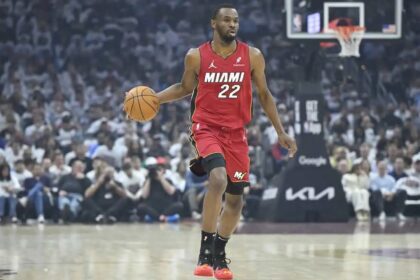 Apr 20, 2025; Cleveland, Ohio, USA; Miami Heat forward Andrew Wiggins (22) brings the ball up court in the first quarter against the Cleveland Cavaliers at Rocket Arena. Mandatory Credit: David Richard-Imagn Images