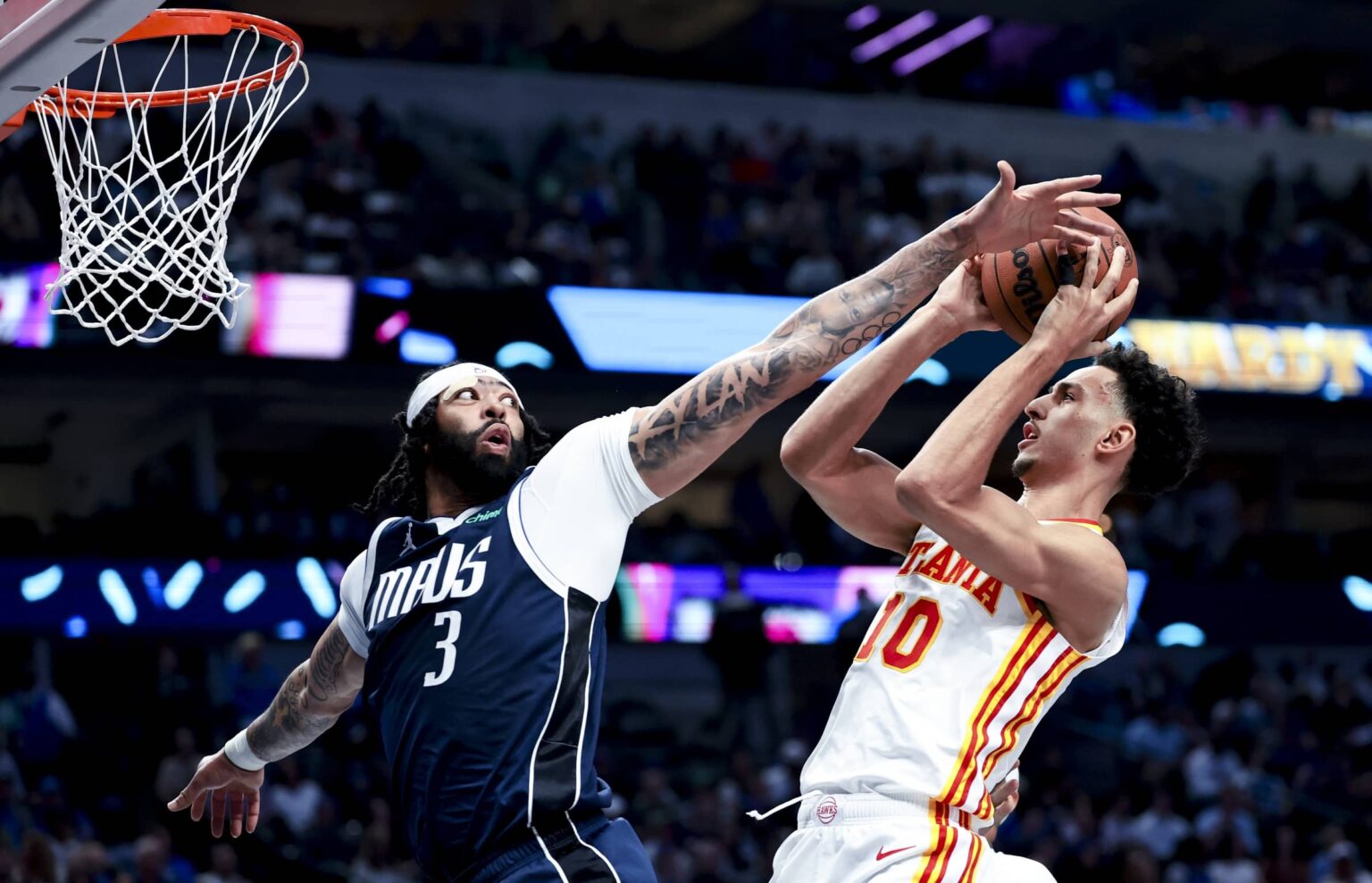 Apr 2, 2025; Dallas, Texas, USA; Dallas Mavericks forward Anthony Davis (3) defends the shot of Atlanta Hawks forward Zaccharie Risacher (10)) during the third quarter at American Airlines Center. Mandatory Credit: Kevin Jairaj-Imagn Images