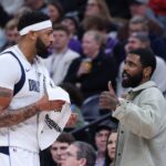 Jan 8, 2026; Salt Lake City, Utah, USA; Dallas Mavericks forward Anthony Davis (l3) and guard Kyrie Irving (right) speak during a second half break in action against the Utah Jazz at Delta Center. Mandatory Credit: Rob Gray-Imagn Images