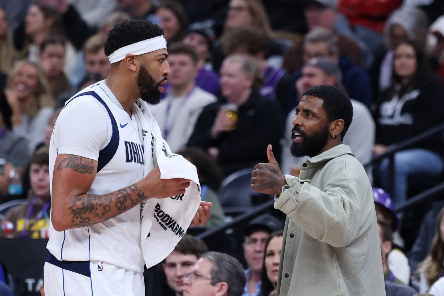 Jan 8, 2026; Salt Lake City, Utah, USA; Dallas Mavericks forward Anthony Davis (l3) and guard Kyrie Irving (right) speak during a second half break in action against the Utah Jazz at Delta Center. Mandatory Credit: Rob Gray-Imagn Images