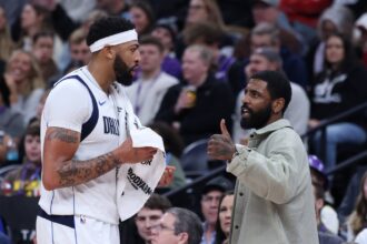 Jan 8, 2026; Salt Lake City, Utah, USA; Dallas Mavericks forward Anthony Davis (l3) and guard Kyrie Irving (right) speak during a second half break in action against the Utah Jazz at Delta Center. Mandatory Credit: Rob Gray-Imagn Images