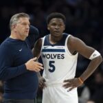 Nov 17, 2025; Minneapolis, Minnesota, USA; Minnesota Timberwolves head coach Chris Finch and Minnesota Timberwolves guard Anthony Edwards (5) looks on against the Dallas Mavericks in the second half at Target Center. Mandatory Credit: Jesse Johnson-Imagn Images