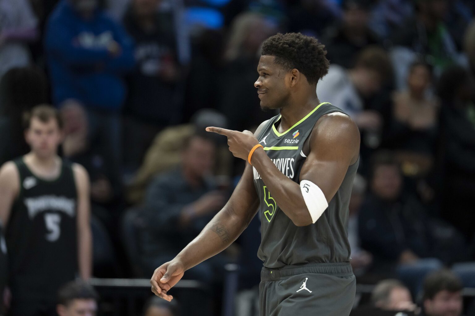 Jan 11, 2026; Minneapolis, Minnesota, USA; Minnesota Timberwolves guard Anthony Edwards (5) points to the San Antonio Spurs bench in the first half at Target Center. Mandatory Credit: Jesse Johnson-Imagn Images