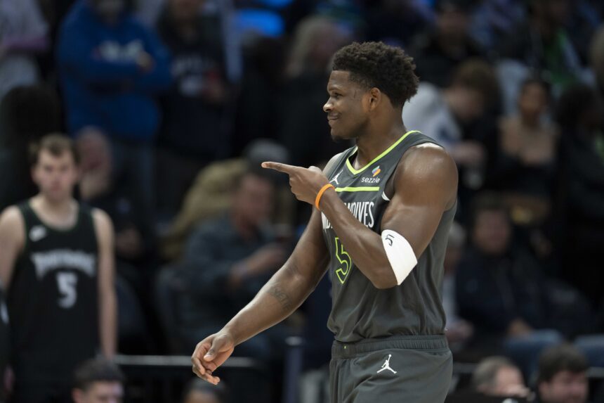 Jan 11, 2026; Minneapolis, Minnesota, USA; Minnesota Timberwolves guard Anthony Edwards (5) points to the San Antonio Spurs bench in the first half at Target Center. Mandatory Credit: Jesse Johnson-Imagn Images