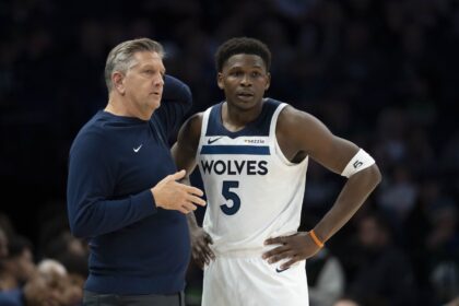 Nov 17, 2025; Minneapolis, Minnesota, USA; Minnesota Timberwolves head coach Chris Finch and Minnesota Timberwolves guard Anthony Edwards (5) looks on against the Dallas Mavericks in the second half at Target Center. Mandatory Credit: Jesse Johnson-Imagn Images