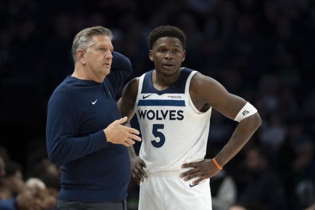 Nov 17, 2025; Minneapolis, Minnesota, USA; Minnesota Timberwolves head coach Chris Finch and Minnesota Timberwolves guard Anthony Edwards (5) looks on against the Dallas Mavericks in the second half at Target Center. Mandatory Credit: Jesse Johnson-Imagn Images