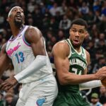 Jan 23, 2025; Milwaukee, Wisconsin, USA; Milwaukee Bucks forward Giannis Antetokounmpo (34) looks for a shot against Miami Heat center Bam Adebayo (13) in the second quarter at Fiserv Forum. Mandatory Credit: Benny Sieu-Imagn Images
