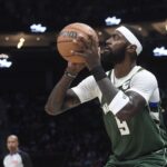 Dec 29, 2025; Charlotte, North Carolina, USA; Milwaukee Bucks forward center Bobby Portis (9) shoots during the first half against the Charlotte Hornets at the Spectrum Center. Mandatory Credit: Sam Sharpe-Imagn Images