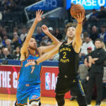 Jan 2, 2026; San Francisco, California, USA; Golden State Warriors guard Brandin Podziemski (2) shoots against Oklahoma City Thunder center Chet Holmgren (7) during the first quarter at Chase Center. Mandatory Credit: Darren Yamashita-Imagn Images