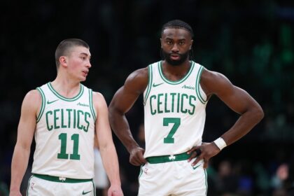 Dec 7, 2024; Boston, Massachusetts, USA; Boston Celtics forward Jaylen Brown (7) and Boston Celtics guard Payton Pritchard (11) talk during the first half against the Memphis Grizzlies at TD Garden. Mandatory Credit: Paul Rutherford-Imagn Images