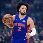 Detroit Pistons guard Cade Cunningham (2) brings the ball up court against the Cleveland Cavaliers during the first quarter at Rocket Arena.