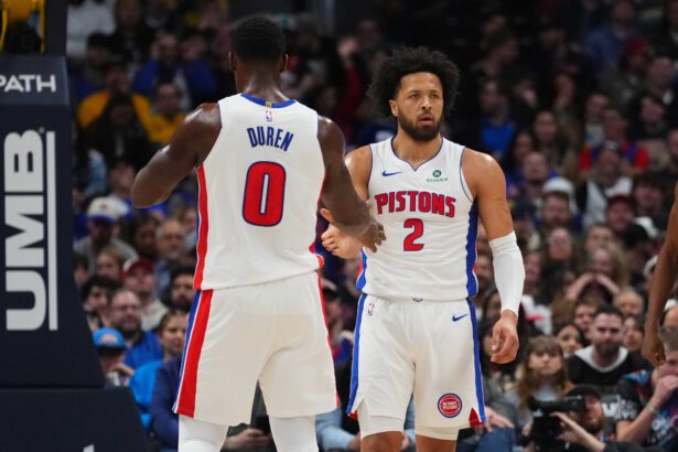 Jan 27, 2026; Denver, Colorado, USA; Detroit Pistons guard Cade Cunningham (2) and center Jalen Duren (0) react to a foul called in the first quarter against the Denver Nuggets at Ball Arena. Mandatory Credit: Ron Chenoy-Imagn Images