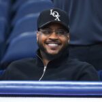 Former professional basketball player Carmelo Anthony looks on prior to the game between the Saint Joseph's Hawks and the Syracuse Orange at the JMA Wireless Dome.