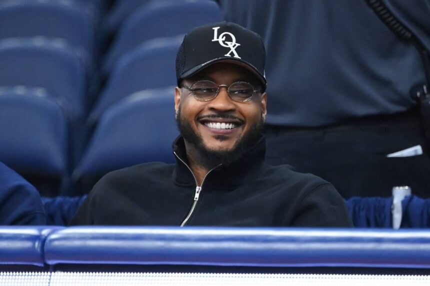 Former professional basketball player Carmelo Anthony looks on prior to the game between the Saint Joseph's Hawks and the Syracuse Orange at the JMA Wireless Dome.