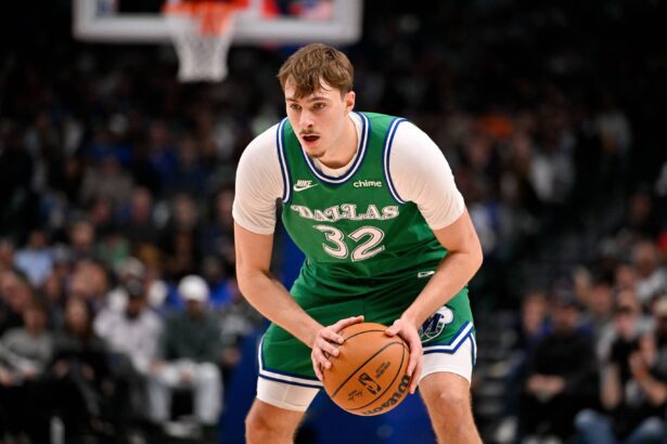 Jan 12, 2026; Dallas, Texas, USA; Dallas Mavericks forward Cooper Flagg (32) looks to move the ball against the Brooklyn Nets during the second quarter at the American Airlines Center. Mandatory Credit: Jerome Miron-Imagn Images
