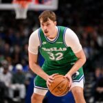 Jan 12, 2026; Dallas, Texas, USA; Dallas Mavericks forward Cooper Flagg (32) looks to move the ball against the Brooklyn Nets during the second quarter at the American Airlines Center. Mandatory Credit: Jerome Miron-Imagn Images