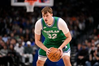 Jan 12, 2026; Dallas, Texas, USA; Dallas Mavericks forward Cooper Flagg (32) looks to move the ball against the Brooklyn Nets during the second quarter at the American Airlines Center. Mandatory Credit: Jerome Miron-Imagn Images