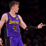 Apr 4, 2025; Los Angeles, California, USA; Los Angeles Lakers guard Dalton Knecht (4) reacts after a 3-point basket in the first half against the New Orleans Pelicans at Crypto.com Arena. Mandatory Credit: Jayne Kamin-Oncea-Imagn Images