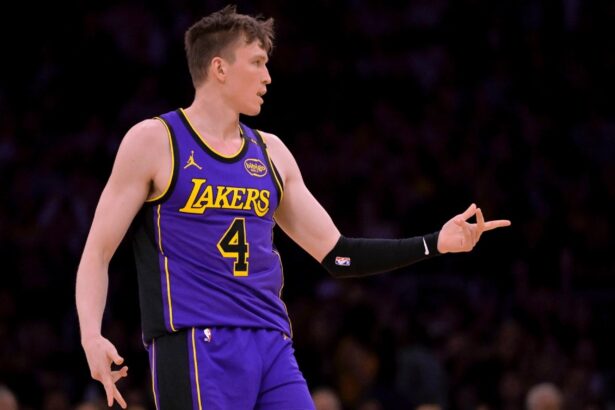 Apr 4, 2025; Los Angeles, California, USA; Los Angeles Lakers guard Dalton Knecht (4) reacts after a 3-point basket in the first half against the New Orleans Pelicans at Crypto.com Arena. Mandatory Credit: Jayne Kamin-Oncea-Imagn Images