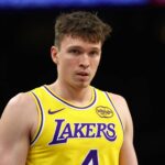 Dec 23, 2025; Phoenix, Arizona, USA; Los Angeles Lakers forward Dalton Knecht (4) against the Phoenix Suns at Mortgage Matchup Center. Mandatory Credit: Mark J. Rebilas-Imagn Images