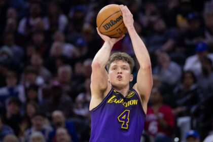 Jan 28, 2025; Philadelphia, Pennsylvania, USA; Los Angeles Lakers guard Dalton Knecht (4) shoots against the Philadelphia 76ers during the second quarter at Wells Fargo Center. Mandatory Credit: Bill Streicher-Imagn Images