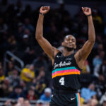 Jan 2, 2026; Indianapolis, Indiana, USA; San Antonio Spurs guard De'Aaron Fox (4) celebrates a made basket in the second half against the Indiana Pacers at Gainbridge Fieldhouse. Mandatory Credit: Trevor Ruszkowski-Imagn Images